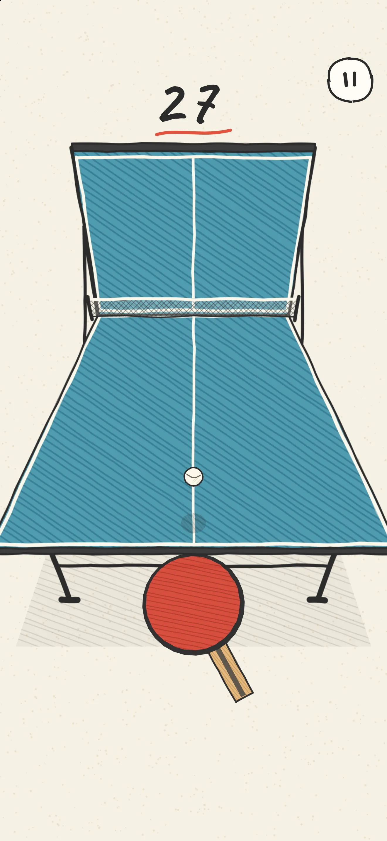 The ball hanging in front of the red paddle at the near edge of the table, ready to serve